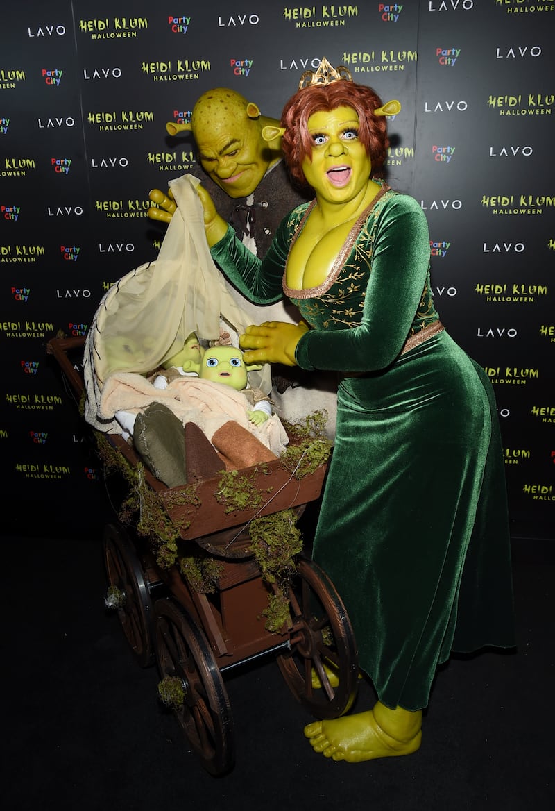 Heidi Klum, right, dressed as Princess Fiona and Tom Kaulitz dressed as Shrek in 2018 (Evan Agostini/Invision/AP)