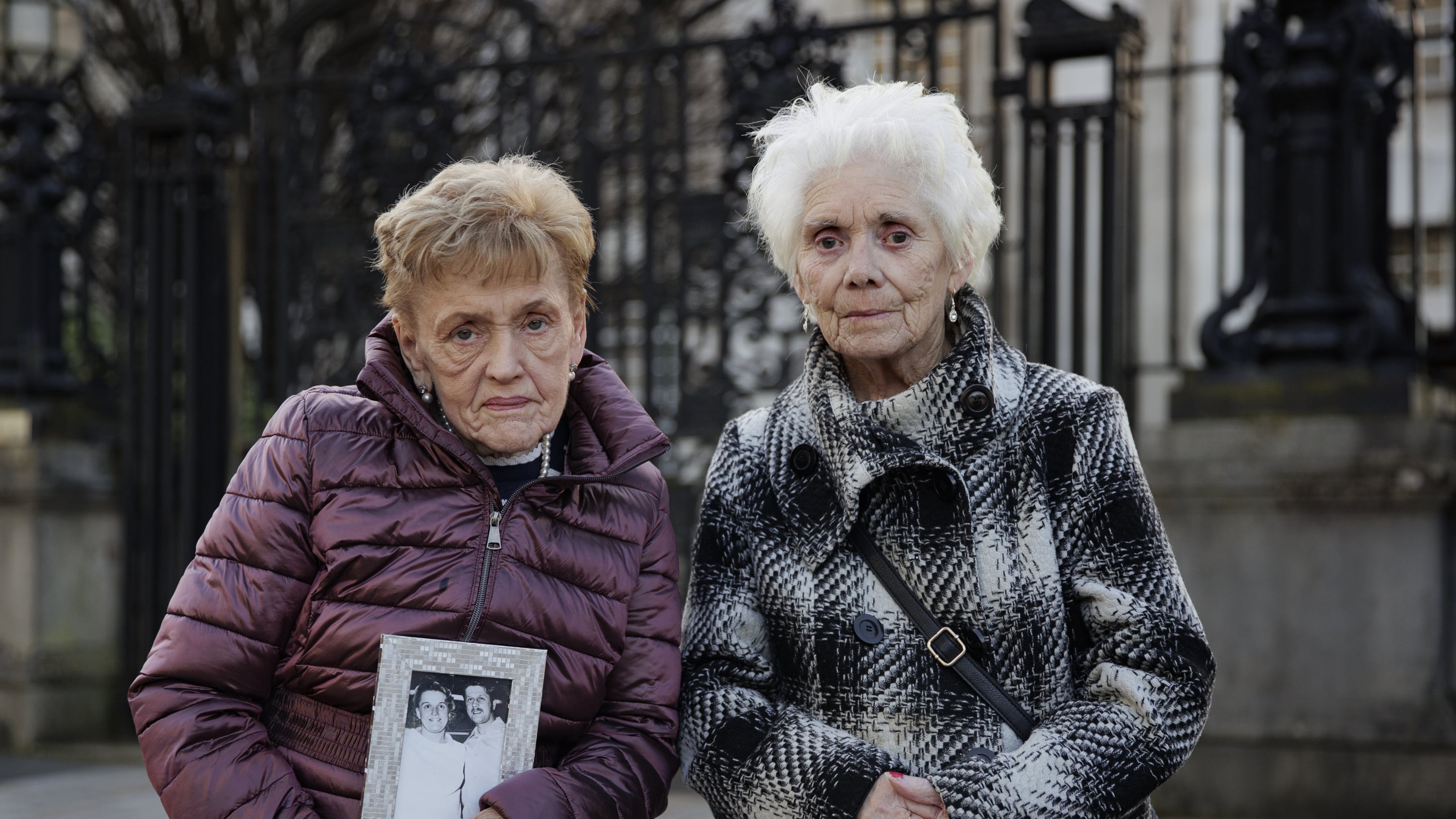 Marie Newton, widow of John Toland, and Mary Loughrey, widow of Jim Loughrey, outside the Royal Courts Justice in Belfast after they settled their cases against the Ministry of Defence and PSNI