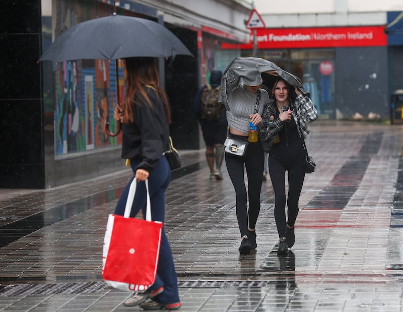 Sheltering from A wet day in Belfast City Centre.
PICTURE COLM LENAGHAN