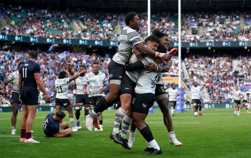 Fiji players celebrate victory over England