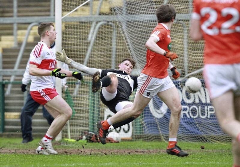 Armagh Andrew Murnin wheels away after putting a goal past Derry keeper Ben McKinless. Picture Margaret McLaughlin. 