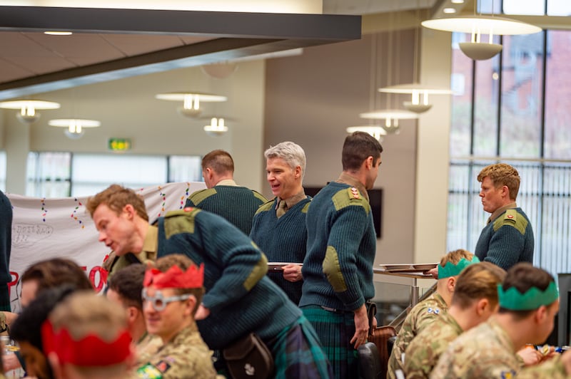 Officers serve soldiers their Christmas lunch during ‘silly week’ – an annual tradition in the Royal Regiment of Scotland