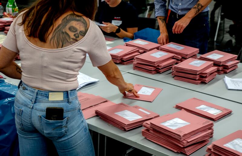 Helpers work on the postal ballots for the European elections in Frankfurt, Germany (Michael Probst/AP)