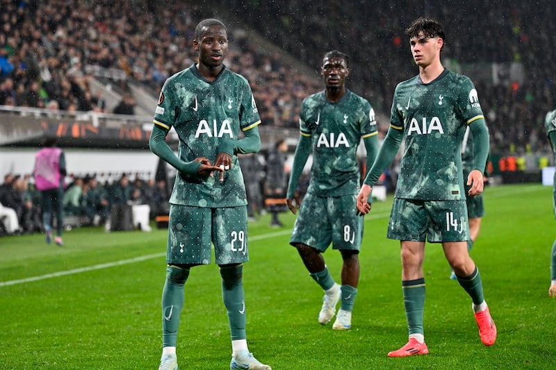 Tottenham celebrate the opening goal (Denes Erdos/AP)