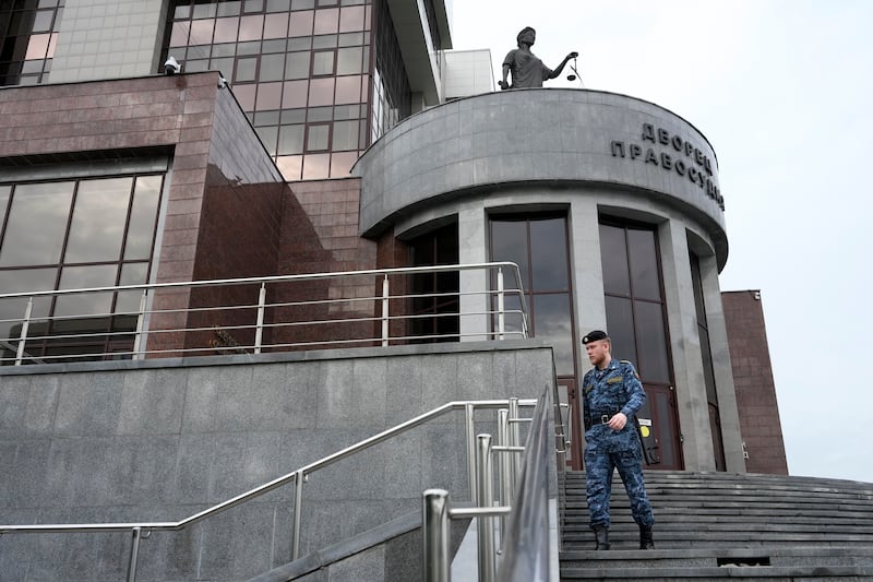 A Russian Federal Bailiffs Service employee patrols around the court building in Yekaterinburg, Russia ahead of the trial of Wall Street Journal reporter Evan Gershkovich