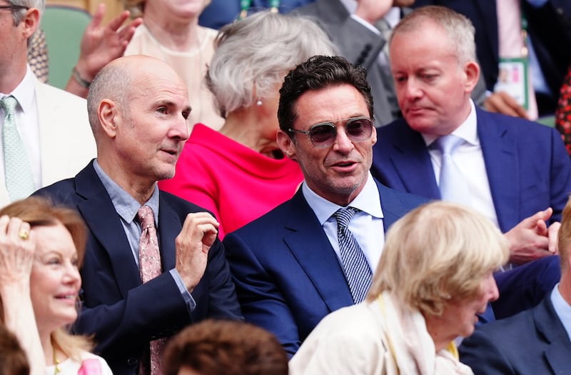 Hugh Jackman (centre) was among the celebrities who watched the Wimbledon women’s singles final on Centre Court on Saturday