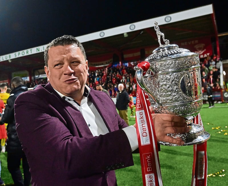 Larne owner Kenny Bruce celebrates after lifting the Gibson Cup trophy

Picture: Colm Lenaghan