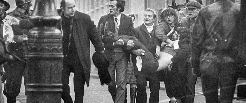 A photograph of Bishop Daly leading a group as they carried victim, Jackie Duddy from the Bogside became one of the iconic images of Bloody Sunday