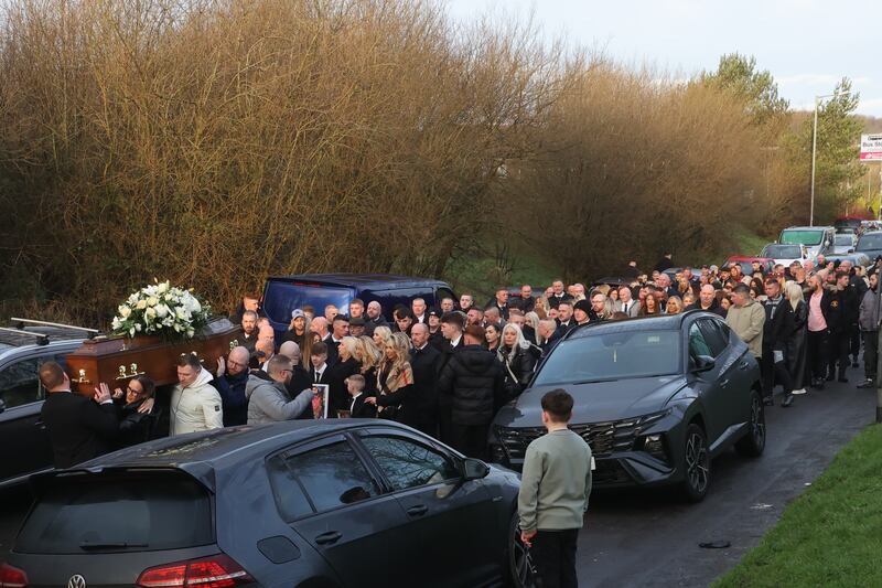 Mourners carried the coffin of murdered Belfast man John George ahead of his funeral at St Luke’s Church