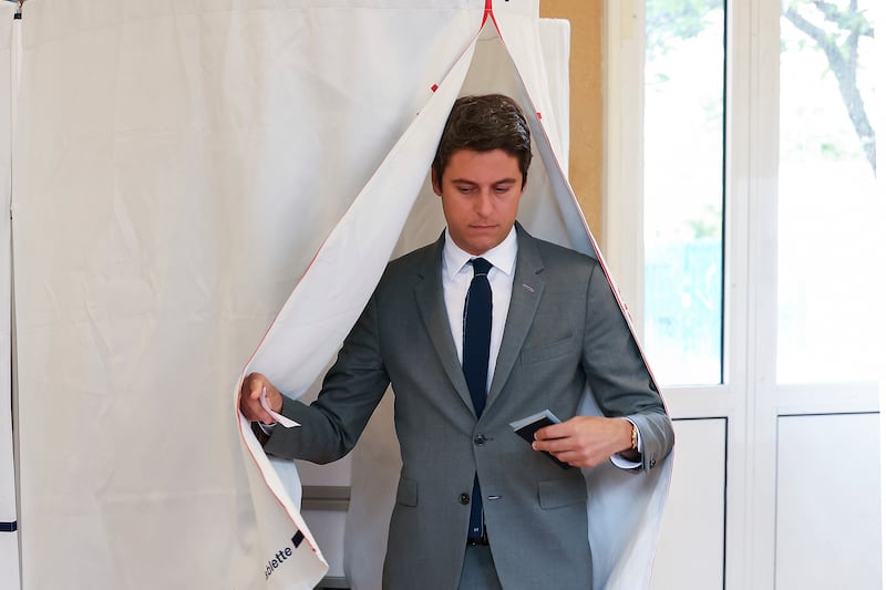 French Prime Minister Gabriel Attal leaving a polling booth earlier on Sunday (Alain Jocard, pool via AP)