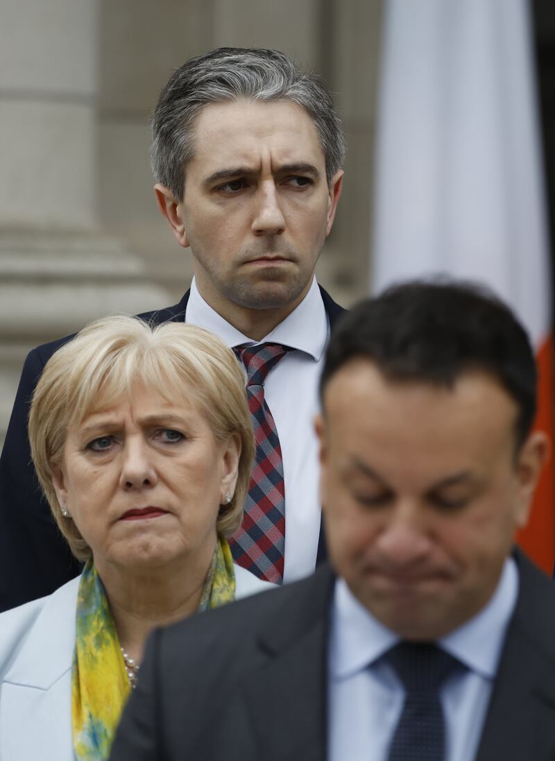 Taoiseach Leo Varadkar (front) resigns as Heather Humphreys and Simon Harris stand next to him