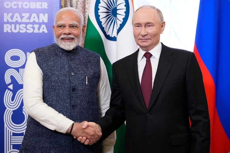 Russian president Vladimir Putin and Indian leader Narendra Modi at the BRICS Summit in Russia, which Mr Modi chose to attend instead of Chogm (Alexander Zemlianichenko/AP)