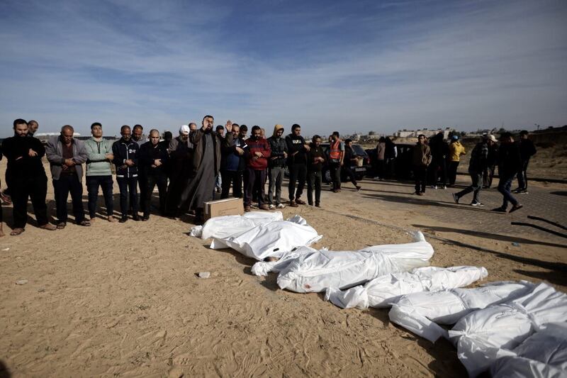 Palestinians pray over their relatives, killed in the Israeli bombardment, in town of Khan Younis, southern Gaza, on Wednesday. PICTURE: AP PHOTO/MOHAMMED DAHMAN 