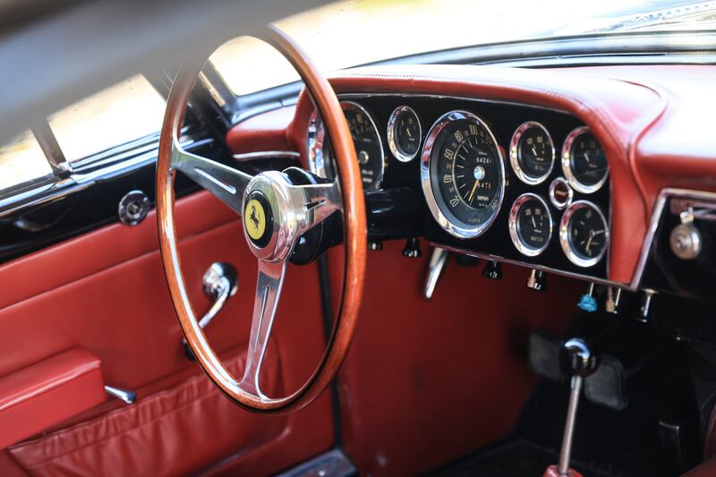 The interior sports an eye-catching red upholstery