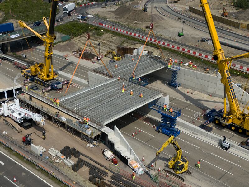 Engineering works taking place at the A3 Wisley interchange at junction 10 of the M25 as concrete beams for a new bridge are installed