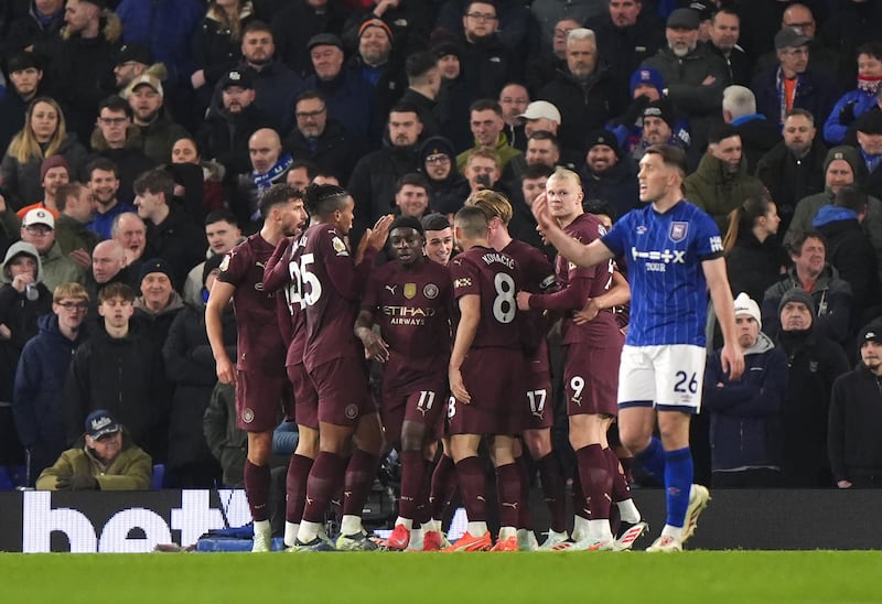 Phil Foden celebrates his second of the game .