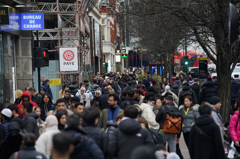 Shoppers on Oxford Street in London on Christmas Eve