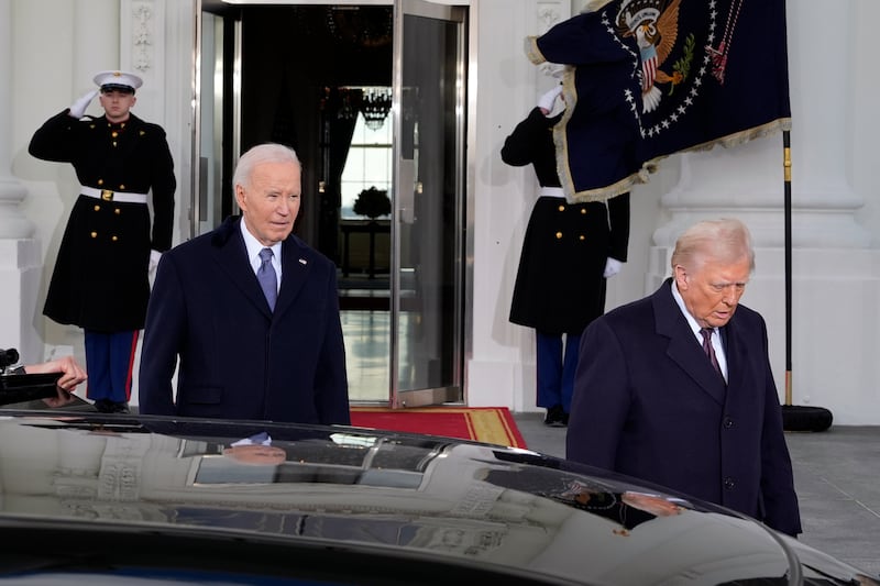 President Joe Biden and President-elect Donald Trump walk out to the presidential limousine, as they depart the White House in Washington en route to the Capitol (Alex Brandon/AP)