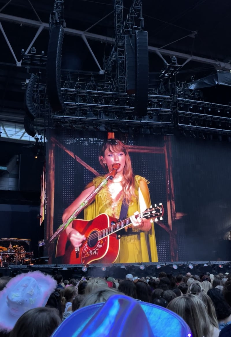 Taylor Swift performs on stage, as seen on a big screen, during her Eras Tour concert at Wembley Stadium