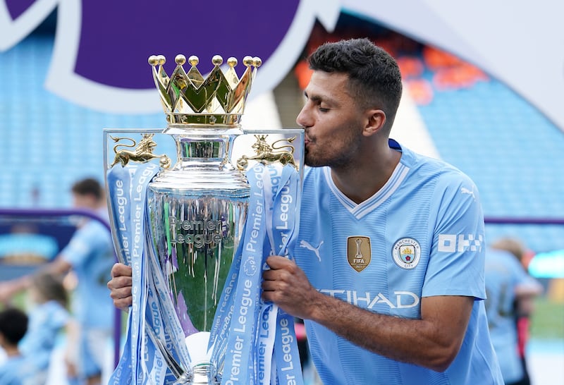 Rodri with the Premier League trophy