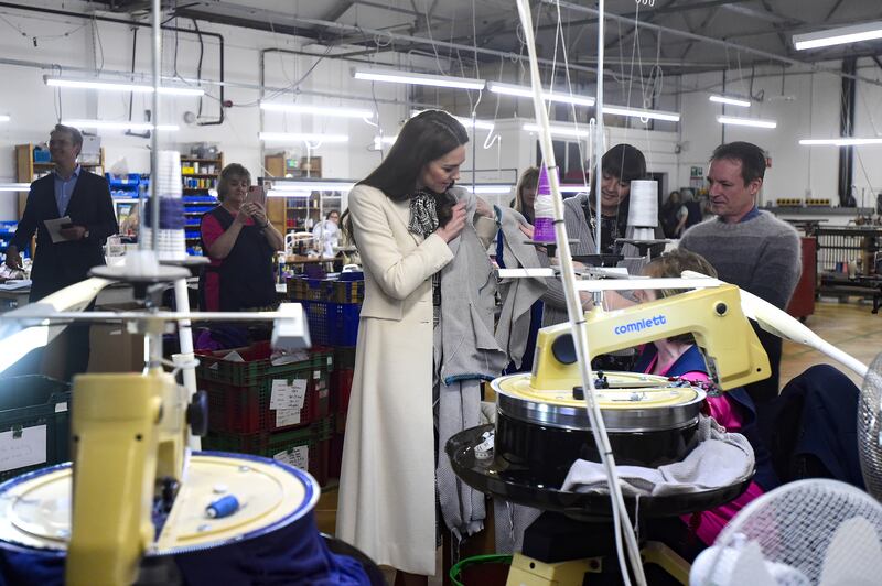 The Princess of Wales spends time with members of the production team on the factory floor during a visit to Corgi, a textiles manufacturer in Ammanford, South Wales