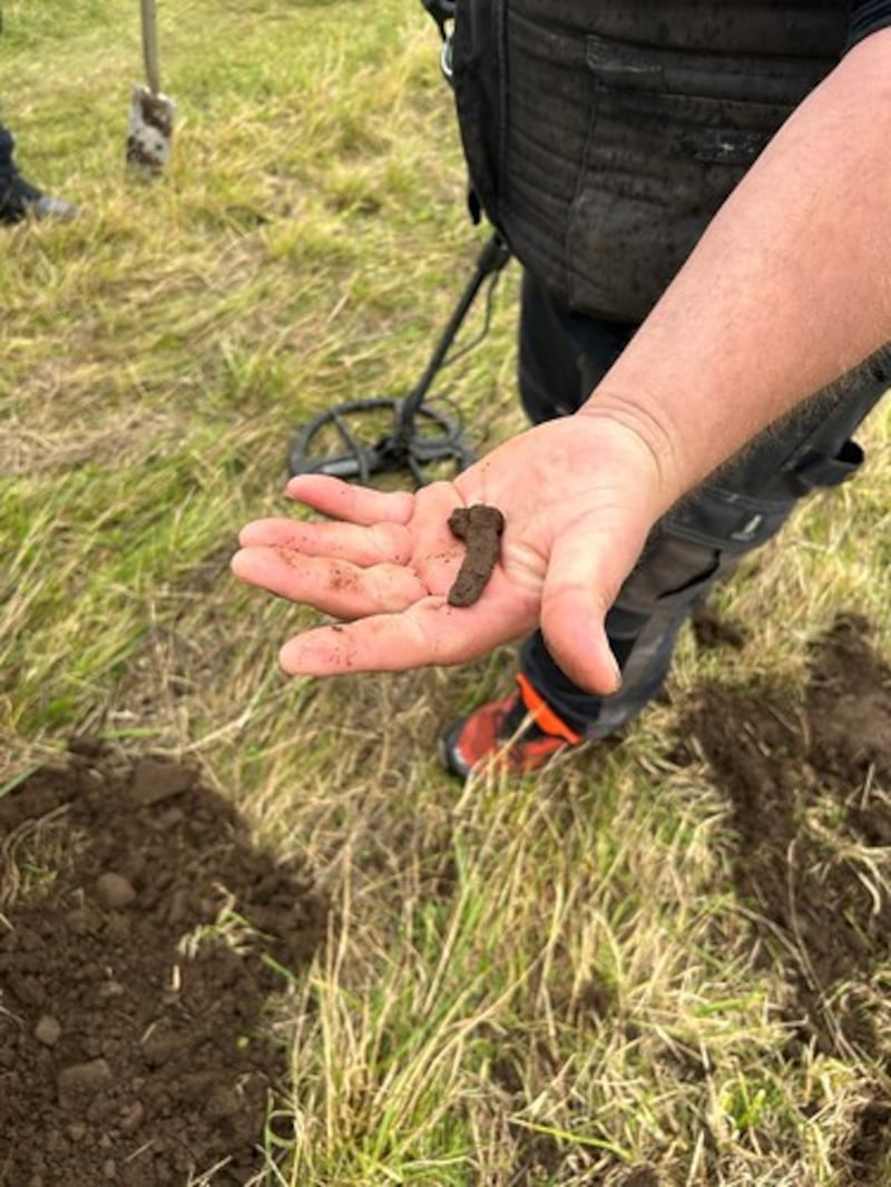 National Trust for Scotland employee Lorne MacLeod holding up his find