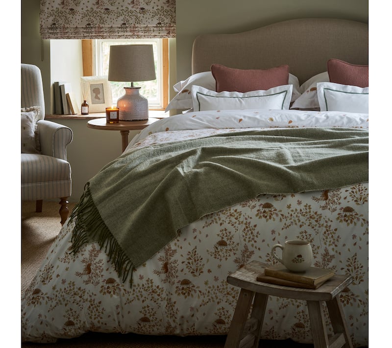 Woodland Friends Bedding Set, from £55, Wool Throw in Olive, £78, Sophie Allport