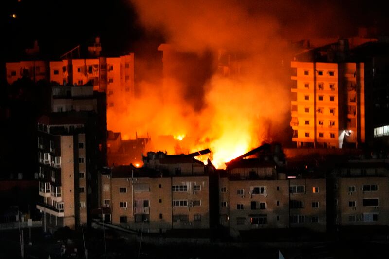 Flame and smoke rises from buildings hit by Israeli airstrikes on Dahiyeh, in the southern suburb of Beirut (Hussein Malla/AP)