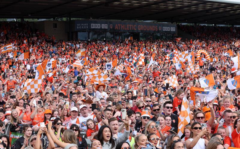 Armagh celebrate with the fans at the Athletic grounds in Armagh on Monday, after winning the All Ireland.
PICTURE COLM LENAGHAN