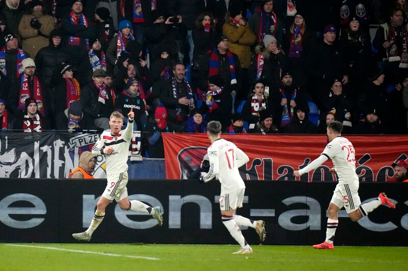 Rasmus Hojlund, left, scored twice for Manchester United (Petr David Josek/AP)