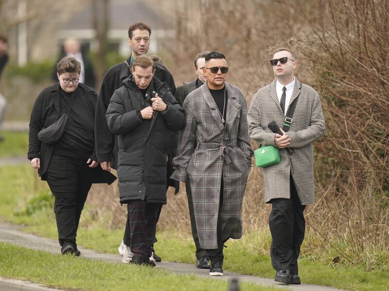 RuPaul’s Drag Race UK contestants Tia Kofi, Baga Chipz (second right) and Cheryl (right) arrive for the funeral of The Vivienne in Denbighshire, North Wales