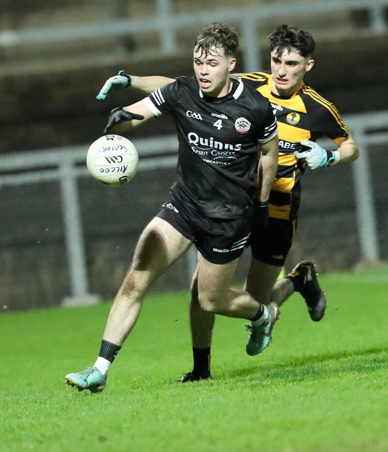 Kilcoo's Callum Rogers and Crosserlough Fionn Lovett in action during the 2024 AIB Ulster Club Senior Quarter Final