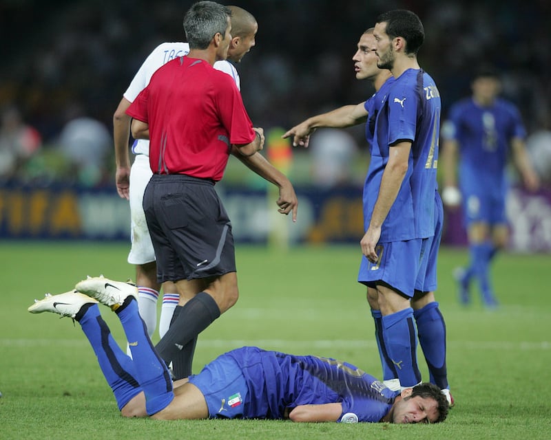 Marco Materazzi lies on the ground after being headbutted by Zidane