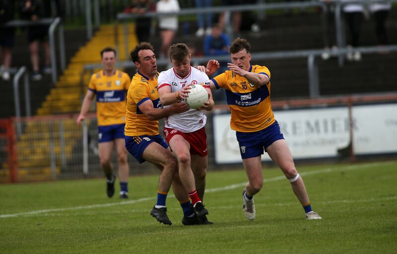 Michael O'Neill and Clare's Daniel Walsh  and Alan Walsh battle it out at Healy Park. Picture: Seamus Loughran