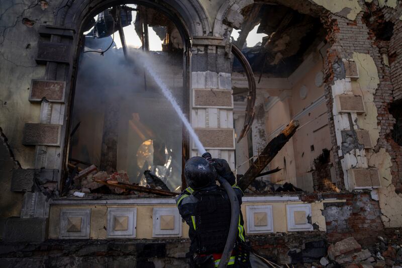 Firefighters put out a blaze at a railway station in the Donetsk region (Alex Babenko/AP)