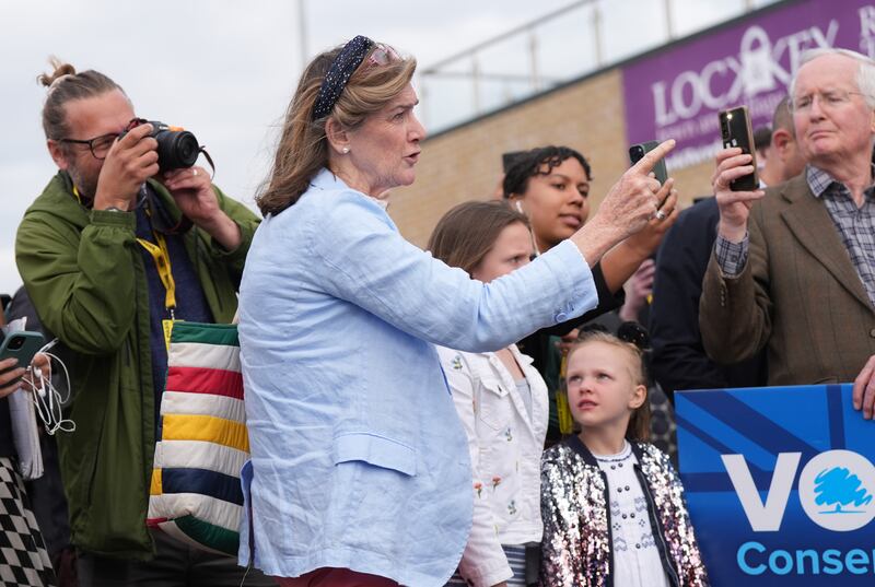GP and Tory member Jane Lees-Millais (centre) heckles Prime Minister Rishi Sunak during a visit to Melksham Town Football Club, during the General Election campaign trail