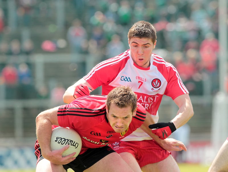 Derry's Ciaran McFaul and Peter Fitzpatrick of Down clash in the Ulster Championship at Celtic Park in 2015. Picture Margaret McLaughlin