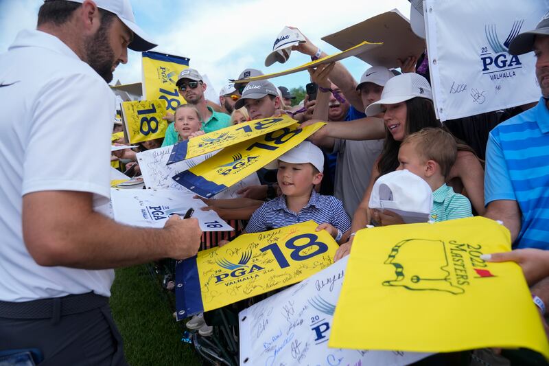 Scottie Scheffler signed autographs after a practice round for the 106th US PGA Championship (Sue Ogrocki/AP)