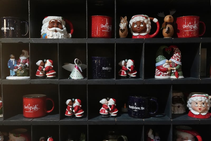 Christmas mugs and decorations on sale in a store in Bethlehem. Tourism accounts for an estimated 70% of Bethlehem’s income and the cancellation of the Christmas festivities has hit the economy hard (AP Photo/Luis Andres Henao)