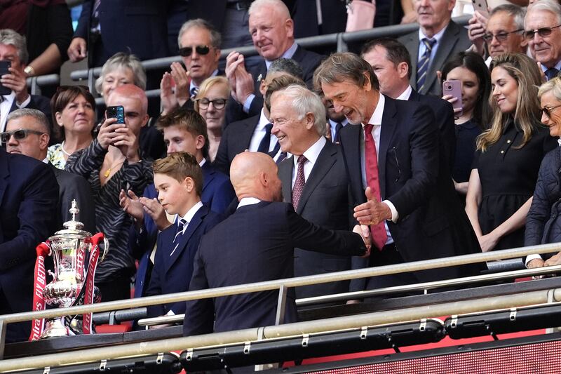 Erik ten Hag (left) shakes hands with Sir Jim Ratcliffe after winning the FA Cup