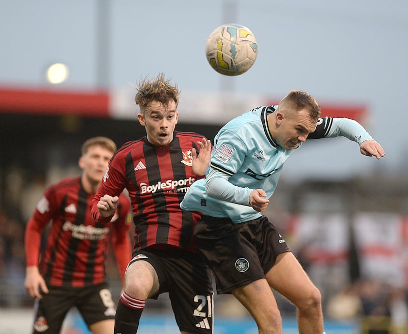 Crusaders' Malachy Smith and Cliftonville's Rory Hale (right) battle for possession during Thursday's north Belfast derby