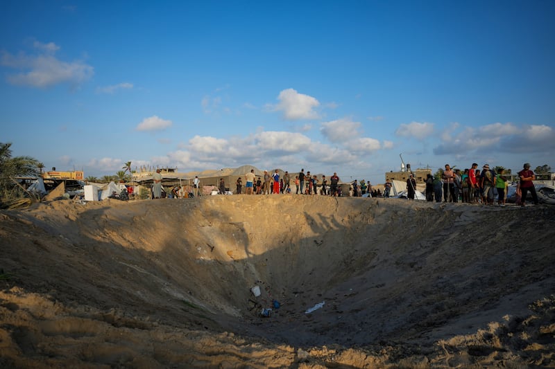 Tens of thousands of Palestinians are living packed in schools and tent camps after fleeing their homes (Abdel Kareem Hana/AP)