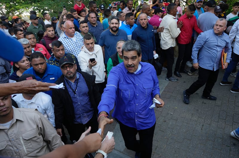 Venezuelan president Nicolas Maduro greets supporters (Ariana Cubillos/AP)
