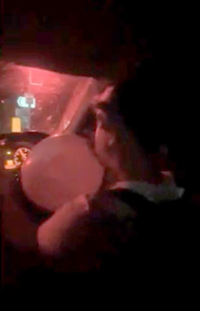 A screengrab of Thomas Johnson with a balloon in his mouth, inhaling nitrous oxide from a video filmed before the crash