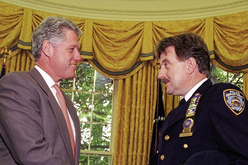 Bill Clinton with decorated NYPD officer and founder of Project Children Denis Mulcahy 