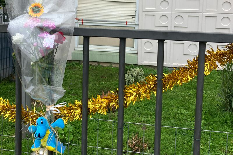 Flowers outside the building in Meaux (Nicolas Garriga/AP)