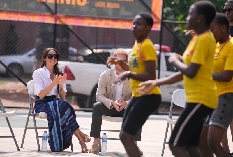 Meghan and Harry watch some dancing (Sunday Alamba/AP)