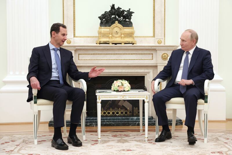 Bashar Assad, left, speaks with Vladimir Putin (Valery Sharifulin, Sputnik, Kremlin Pool Photo/AP)