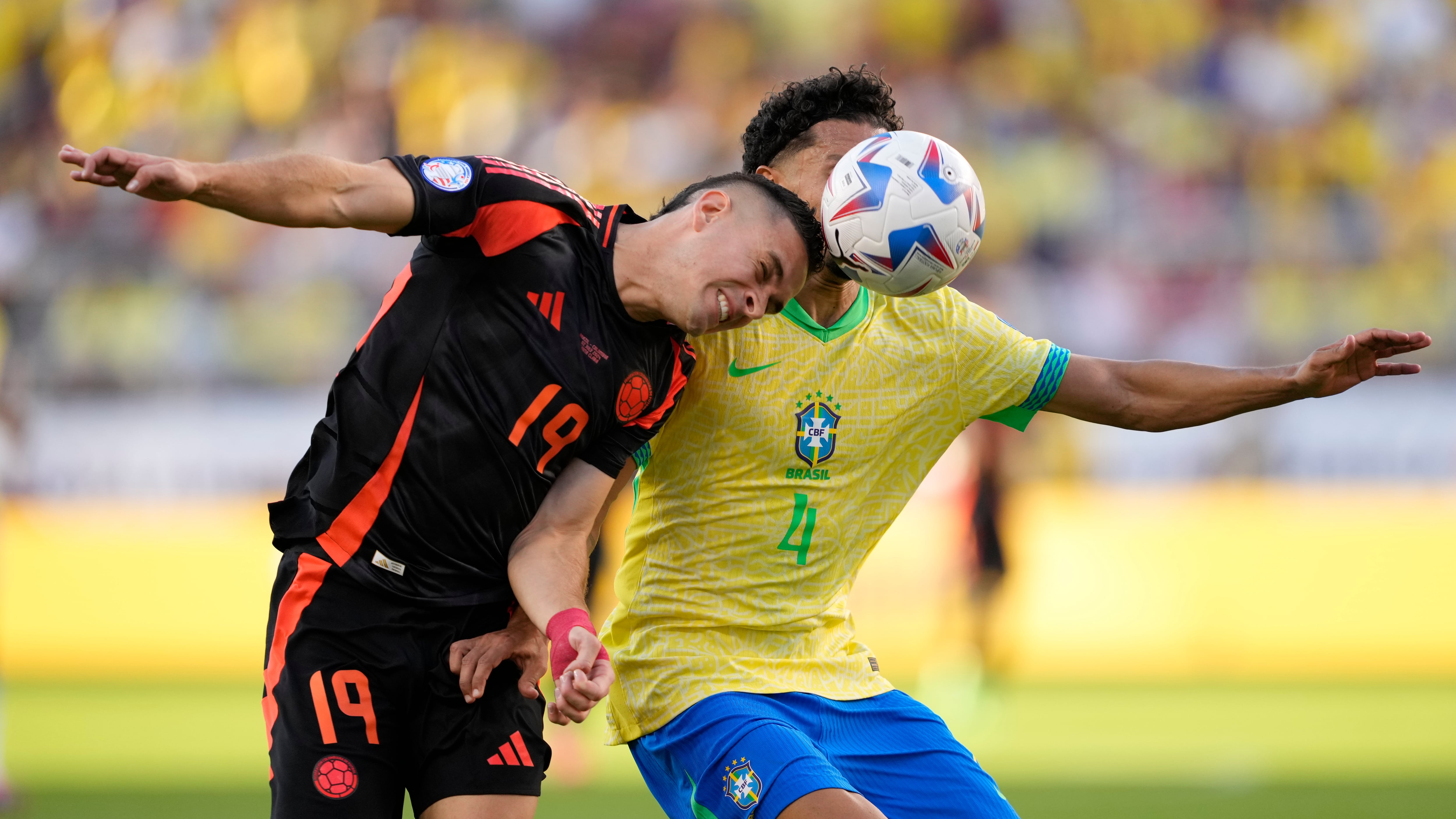 Colombia’s Rafael Santos Borre, left, and Brazil’s Marquinhos battle for the ball during a Copa America Group D soccer match (Tony Avelar/AP)