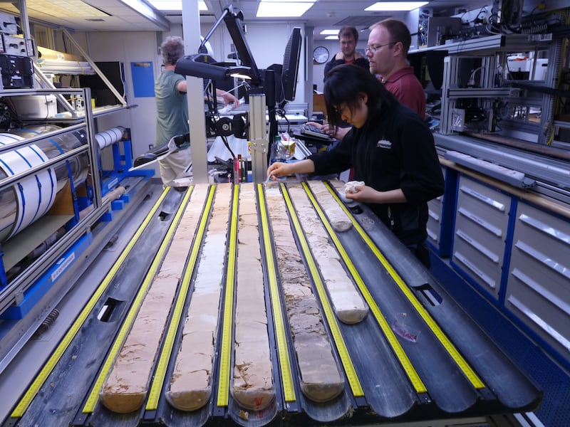 Researchers analysing ocean sediment samples.